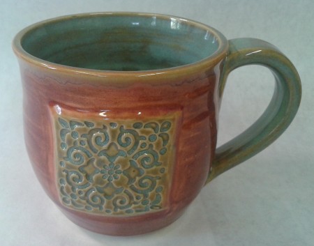 white stoneware clay Tile on side Texture Turquoise on sprig, handle and inside Plum on outside